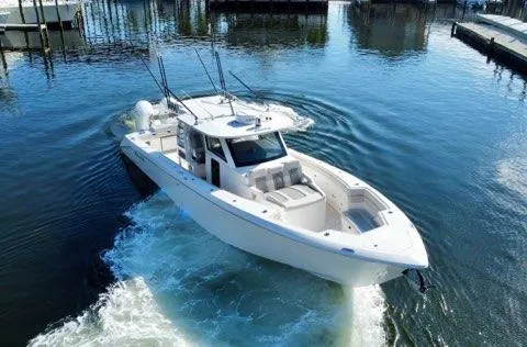 Slide: The Image of 2023 Solace 41 CS boat cruising in a marina. - 15