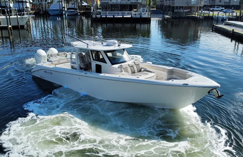 Slide: The Image of 2023 Solace 41 CS boat cruising in a marina. - 16