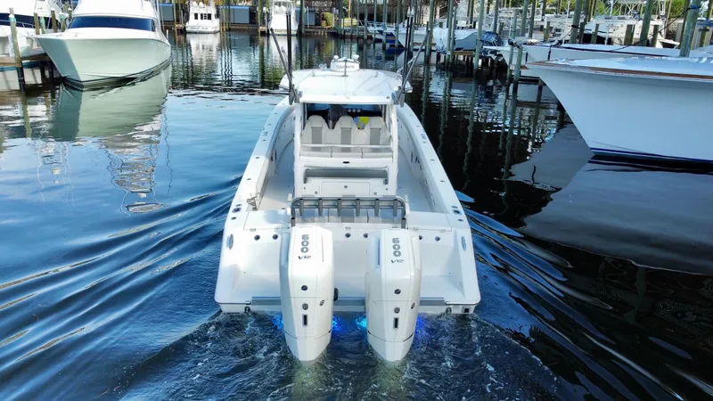 Slide: The Image of 2023 Solace 41 CS boat with twin engines in a marina. - 17