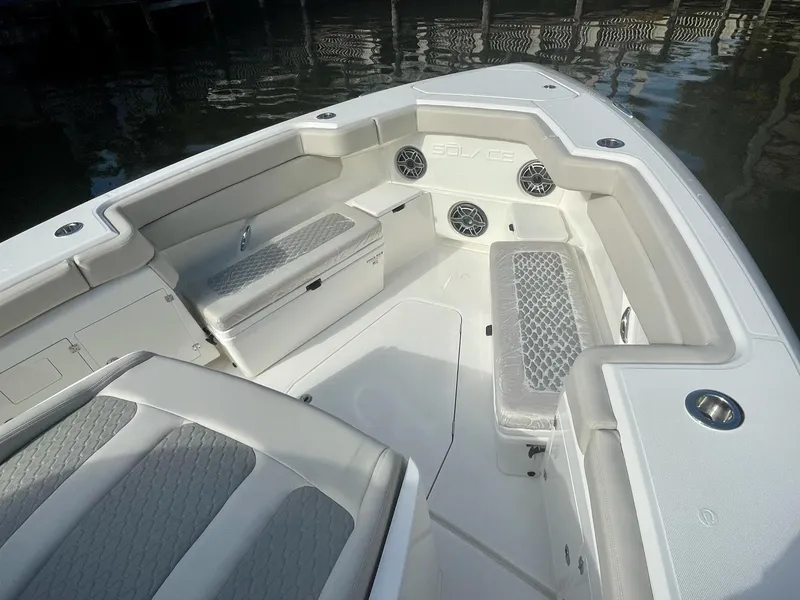 Slide: The Image of 2023 Solace 41 CS boat interior with cushioned seating and storage compartments. - 19