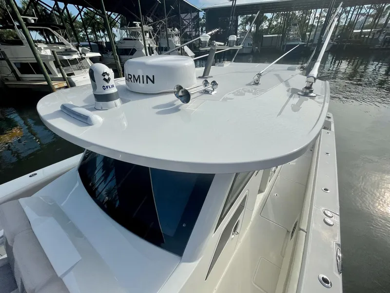 Slide: The Image of 2023 Solace 41 CS boat with Garmin radar in marina. - 23