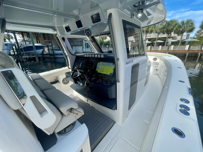 Slide: The Image of 2023 Solace 41 CS boat interior with modern navigation system and comfortable seating. - 25