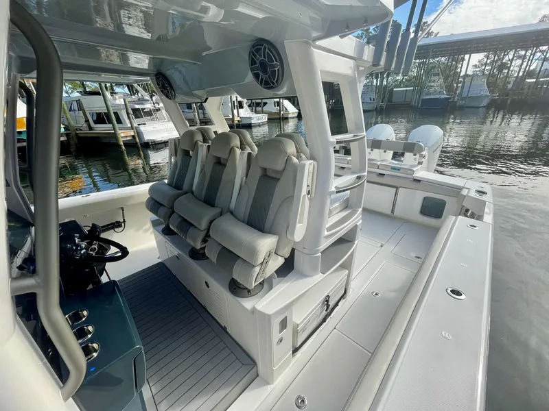 Slide: The Image of 2023 Solace 41 CS boat interior with seating and helm station. - 27