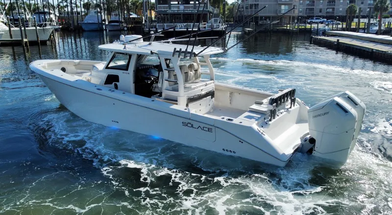 Slide: The Image of 2023 Solace 41 CS boat cruising in a marina. - 3