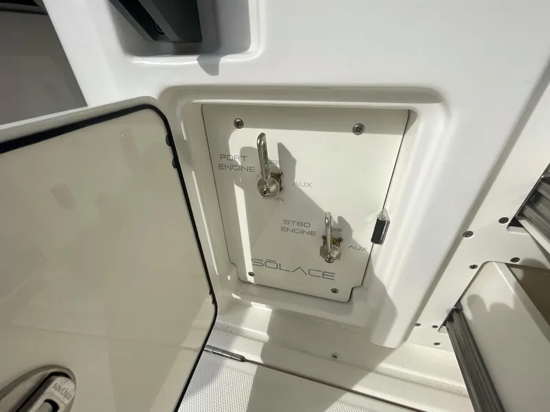 Slide: The Image of Control panel of a 2023 Solace 41 CS boat with engine switches. - 33