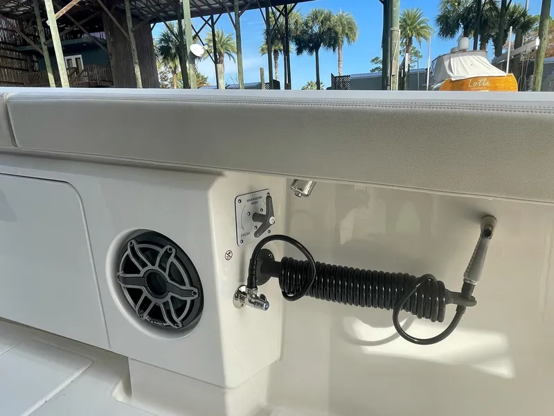 Slide: The Image of 2023 Solace 41 CS boat interior with speaker and coiled hose. - 35