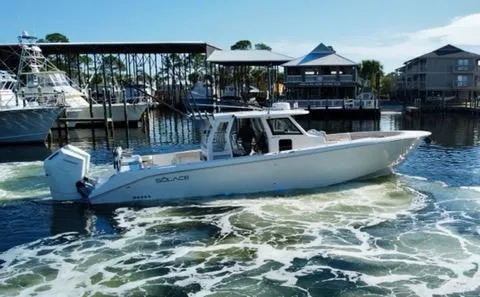 Slide: The Image of 2023 Solace 41 CS boat cruising in a marina. - 4