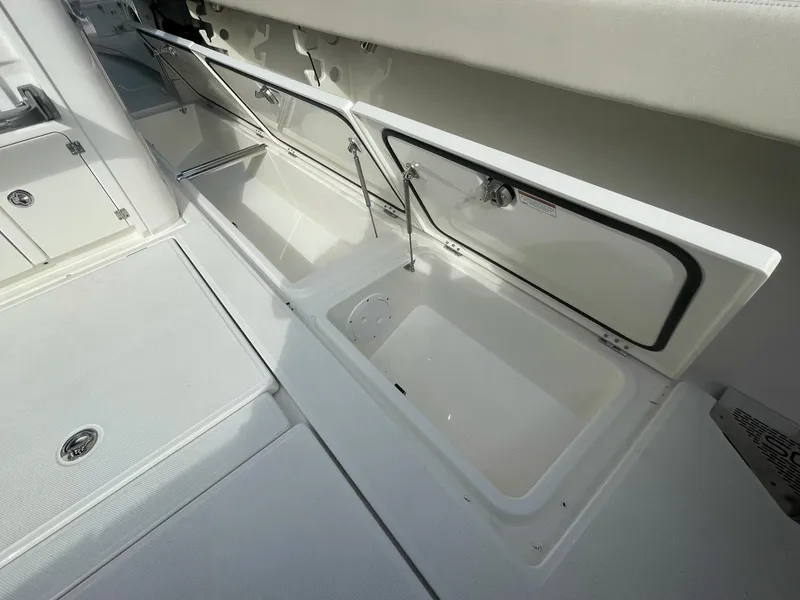 Slide: The Image of 2023 Solace 41 CS boat storage compartments open. - 43