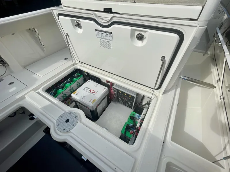Slide: The Image of Battery compartment of 2023 Solace 41 CS boat with open hatch. - 45