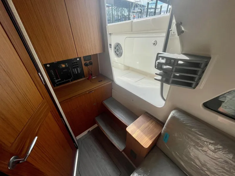 Slide: The Image of Interior of 2023 Solace 41 CS boat with wooden cabinetry and seating area. - 48