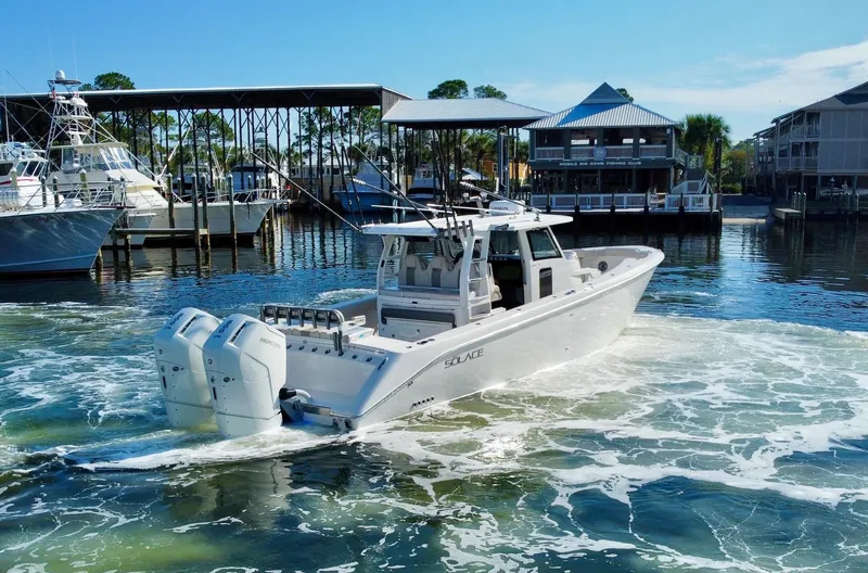 Slide: The Image of 2023 Solace 41 CS boat in marina with twin engines. - 7