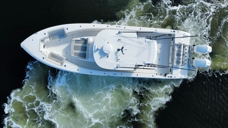 Slide: The Image of Aerial view of 2023 Solace 41 CS boat cruising on water. - 8