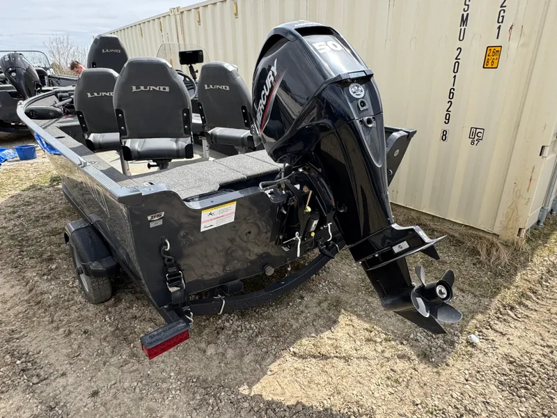 Slide: The Image of 2021 Lund 1650 Angler SS boat with Mercury outboard motor, parked on trailer. - 4