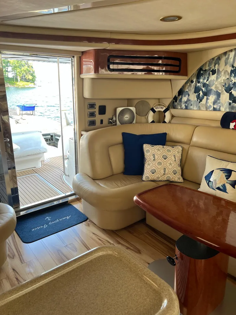 Slide: The Image of Interior of 2003 Sea Ray 480 Sedan Bridge yacht with elegant seating and decor. - 15