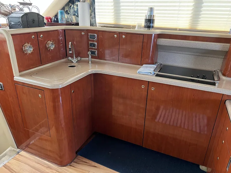 Slide: The Image of Luxurious kitchen area in a 2003 Sea Ray 480 Sedan Bridge yacht. - 22