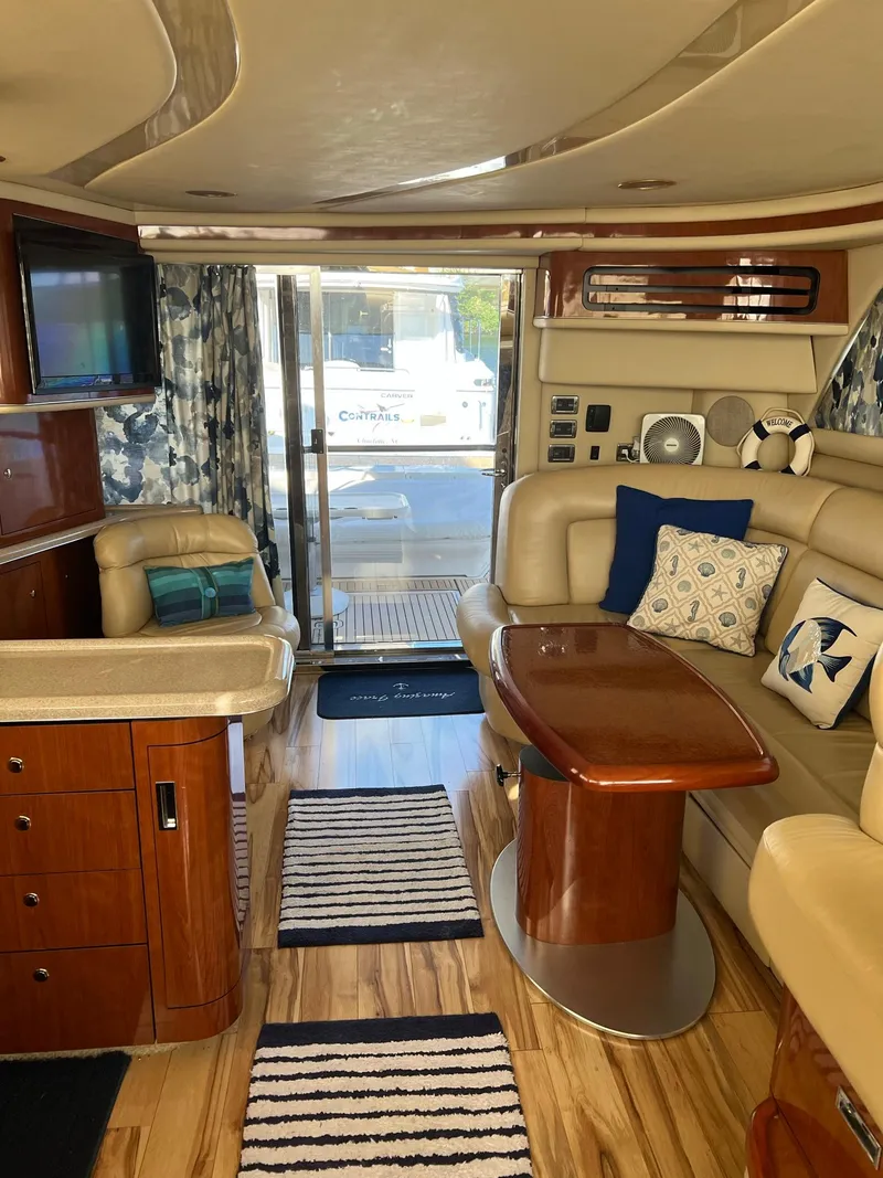 Slide: The Image of Luxurious interior of a 2003 Sea Ray 480 Sedan Bridge yacht with elegant furnishings. - 26