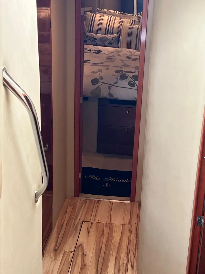 Slide: The Image of Interior hallway of 2003 Sea Ray 480 Sedan Bridge yacht, leading to a cozy bedroom. - 37