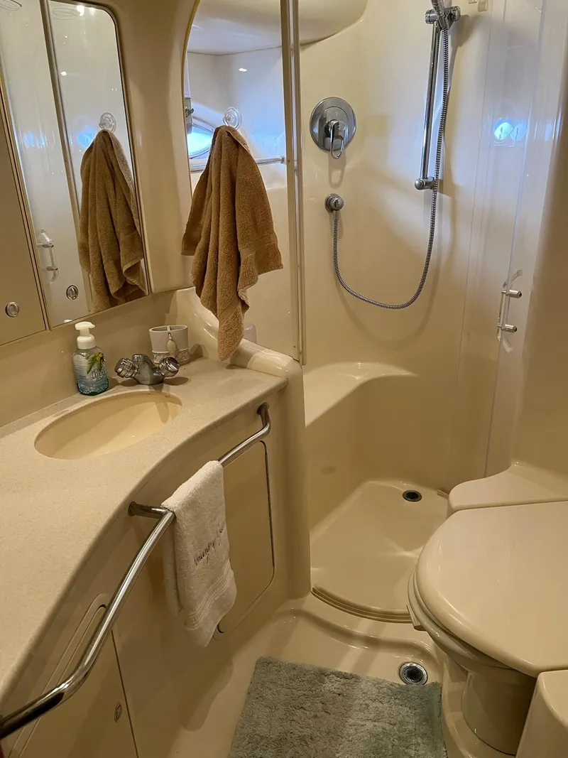 Slide: The Image of Luxurious bathroom in 2003 Sea Ray 480 Sedan Bridge yacht with shower and vanity. - 39