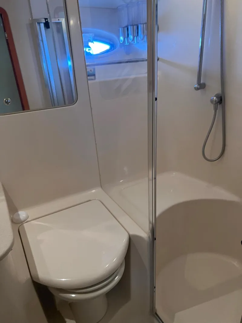 Slide: The Image of Bathroom interior of 2003 Sea Ray 480 Sedan Bridge yacht with shower and toilet. - 42