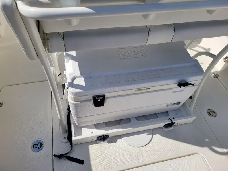 Slide: The Image of 2020 Mako 236 CC DUAL boat with built-in cooler storage. - 11