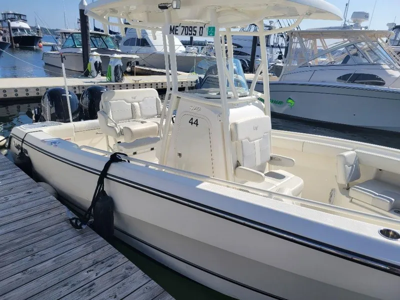 Slide: The Image of 2020 Mako 236 CC Dual boat docked at marina with other boats. - 13
