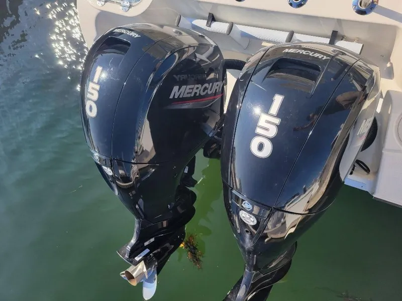Slide: The Image of Twin Mercury 150 outboard engines on a 2020 Mako 236 CC DUAL boat. - 3
