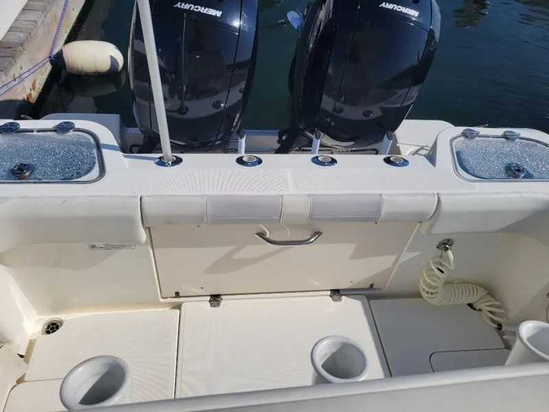 Slide: The Image of 2020 Mako 236 CC Dual boat with twin Mercury engines. - 8