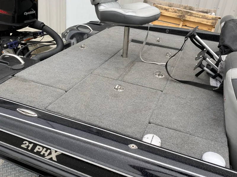 Slide: The Image of Phoenix 21 PHX 2018 model fishing boat with gray deck and seating. - 11