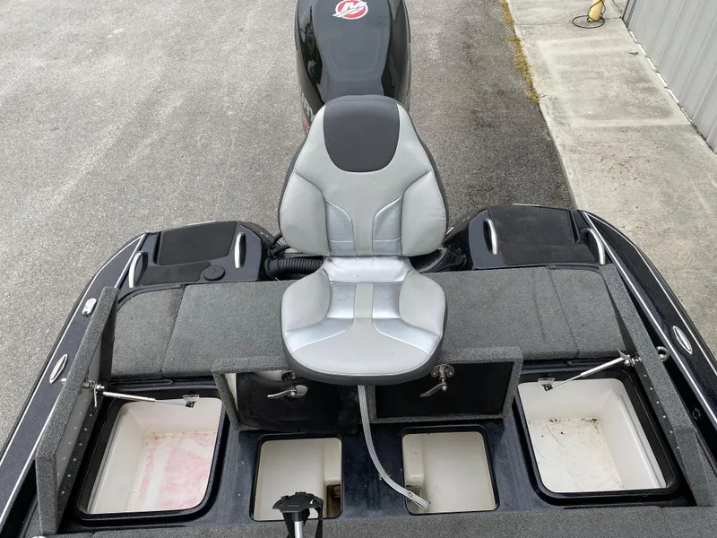 Slide: The Image of 2018 Phoenix 21 boat with a central seat and storage compartments. - 12