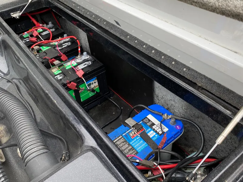Slide: The Image of Boat battery compartment of a 2018 Phoenix 21 model with multiple batteries. - 13