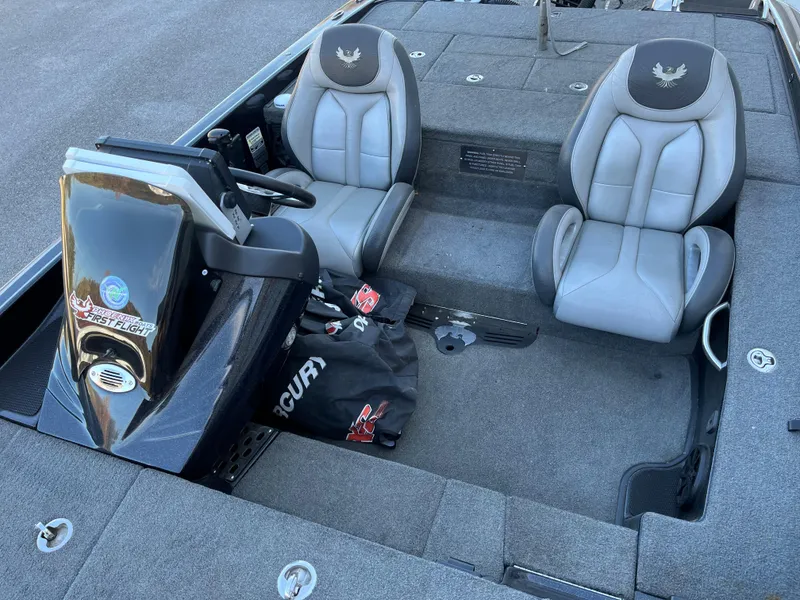 Slide: The Image of 2018 Phoenix 21 boat interior with dual seats and steering console. - 6