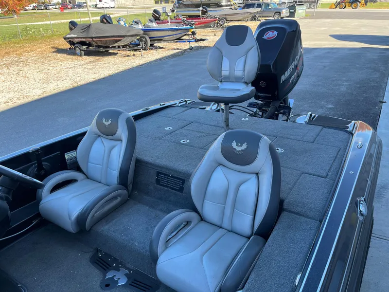 Slide: The Image of 2018 Phoenix 21 boat with three gray seats and Mercury outboard motor. - 7