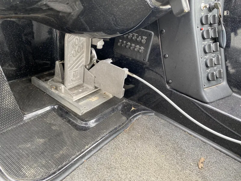 Slide: The Image of Foot pedal and control panel inside a 2018 Phoenix 21 boat. - 9