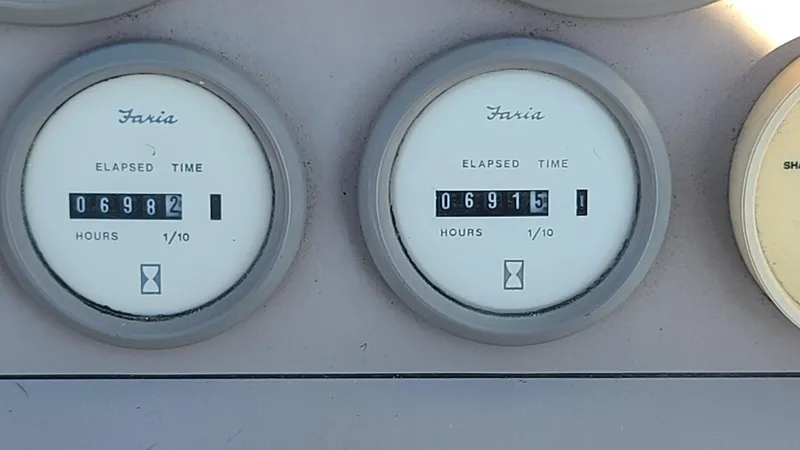 Slide: The Image of Close-up of Faria elapsed time meters on a 1994 Larson 300 Cabrio boat. - 27