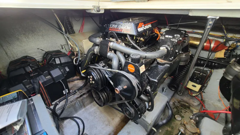 Slide: The Image of 1994 Larson 300 Cabrio engine compartment with MerCruiser engine. - 29