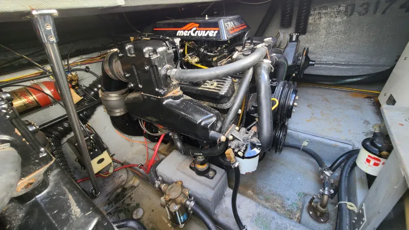 Slide: The Image of 1994 Larson 300 Cabrio engine compartment with MerCruiser engine. - 30