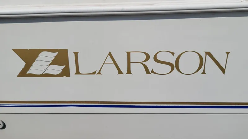 Slide: The Image of 1994 Larson 300 Cabrio boat logo on white hull - 33