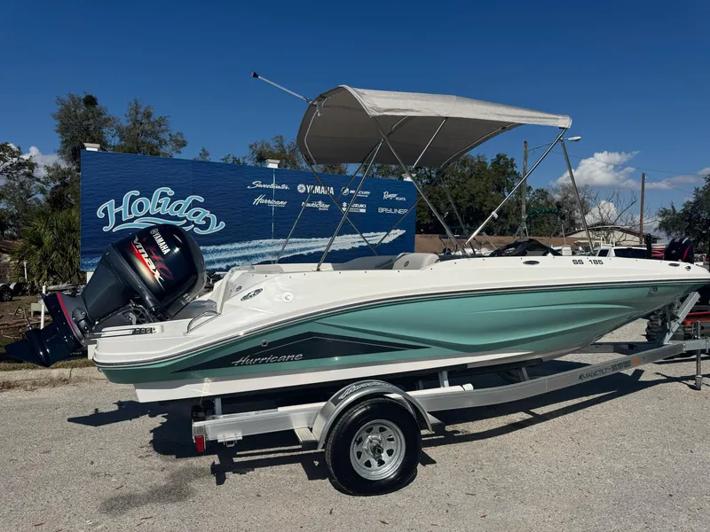Slide: The Image of 2025 Hurricane SS185 boat on trailer, parked outdoors under clear sky. - 2