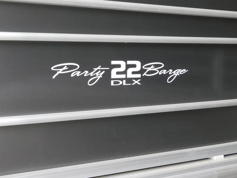 Slide: The Image of 2023 Sun Tracker Party Barge 22 RF DLX logo on boat exterior. - 10