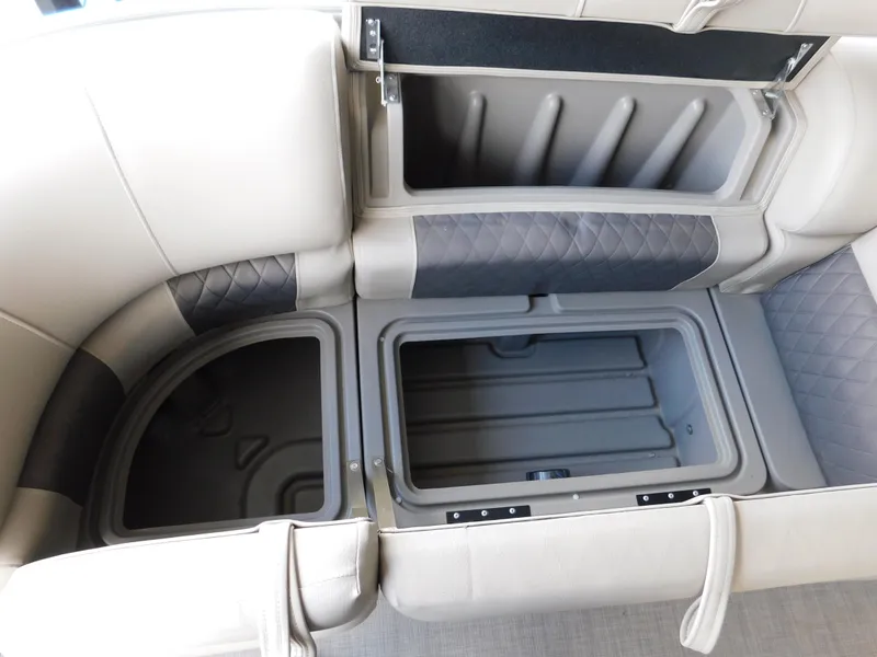 Slide: The Image of 2023 Sun Tracker Party Barge 22 RF DLX storage compartments with cushioned seating. - 11