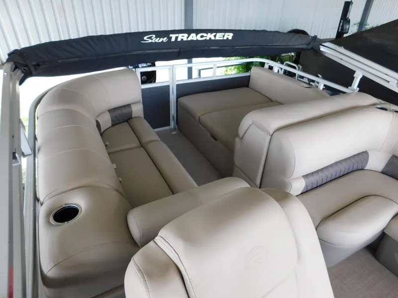 Slide: The Image of 2023 Sun Tracker Party Barge 22 RF DLX with beige seating and canopy. - 12
