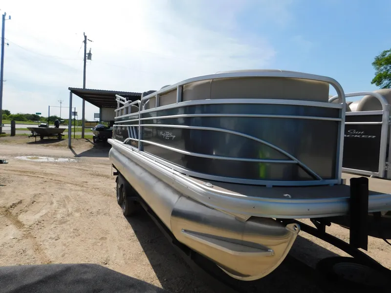 Slide: The Image of 2023 Sun Tracker Party Barge 22 RF DLX pontoon boat on a trailer. - 2