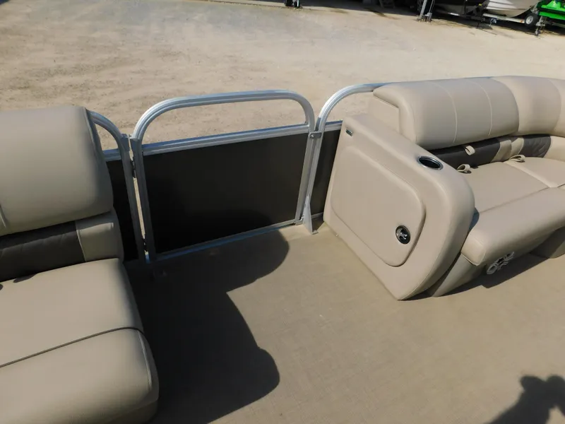Slide: The Image of 2023 Sun Tracker Party Barge 22 RF DLX interior seating area with beige upholstery. - 23