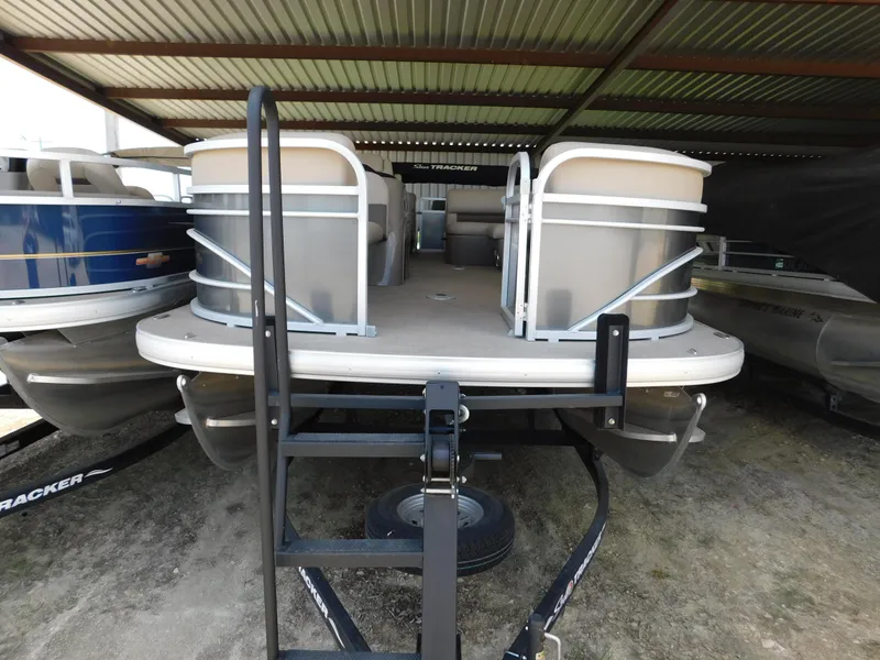 Slide: The Image of 2023 Sun Tracker Party Barge 22 RF DLX pontoon boat in covered storage. - 6