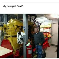 Slide: The Image of Man standing next to a large yellow engine inside a 1936 Dravo Sternwheeler. - 29