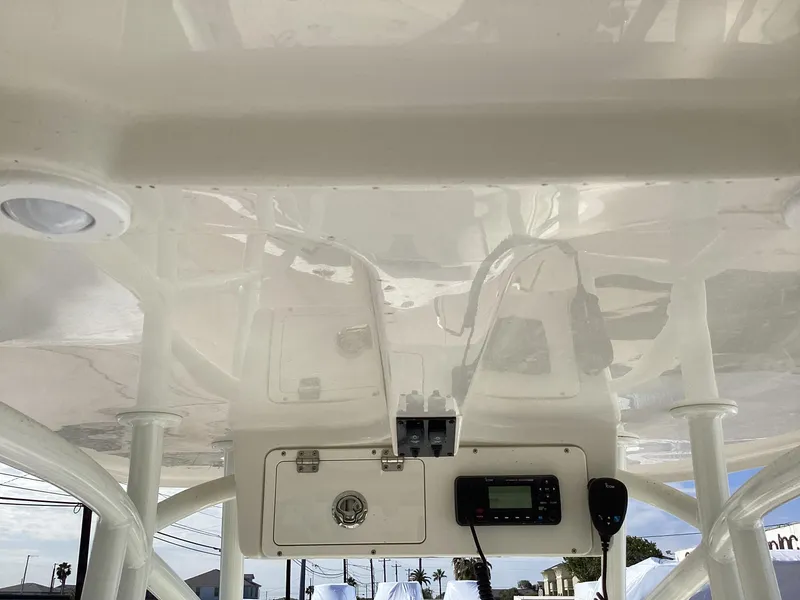 Slide: The Image of 2022 Sailfish 220 CC boat console with radio and storage compartment. - 6