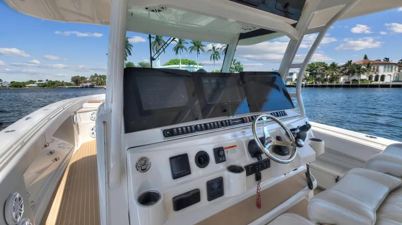 Slide: The Image of 2018 HCB 53 Sueños boat helm with modern navigation equipment. - 11