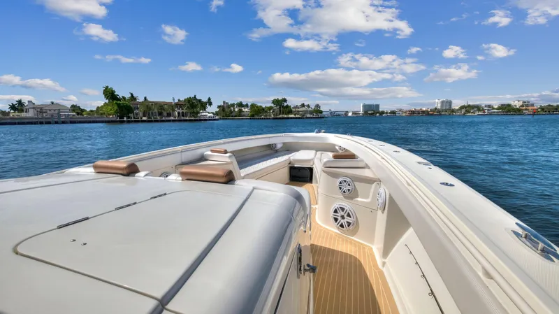 Slide: The Image of 2018 HCB 53 Sueños luxury boat cruising on a sunny day. - 16