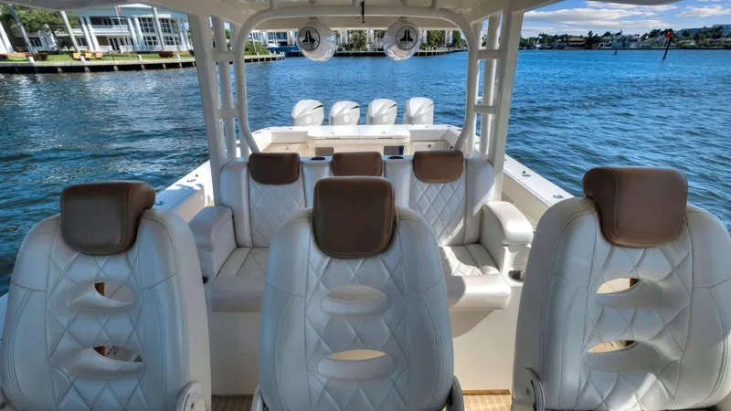 Slide: The Image of Luxury seating on 2018 HCB 53 Sueños boat with waterfront view. - 17