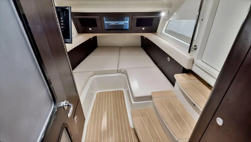 Slide: The Image of 2018 HCB 53 Sueños cabin interior with modern design and wooden steps. - 21